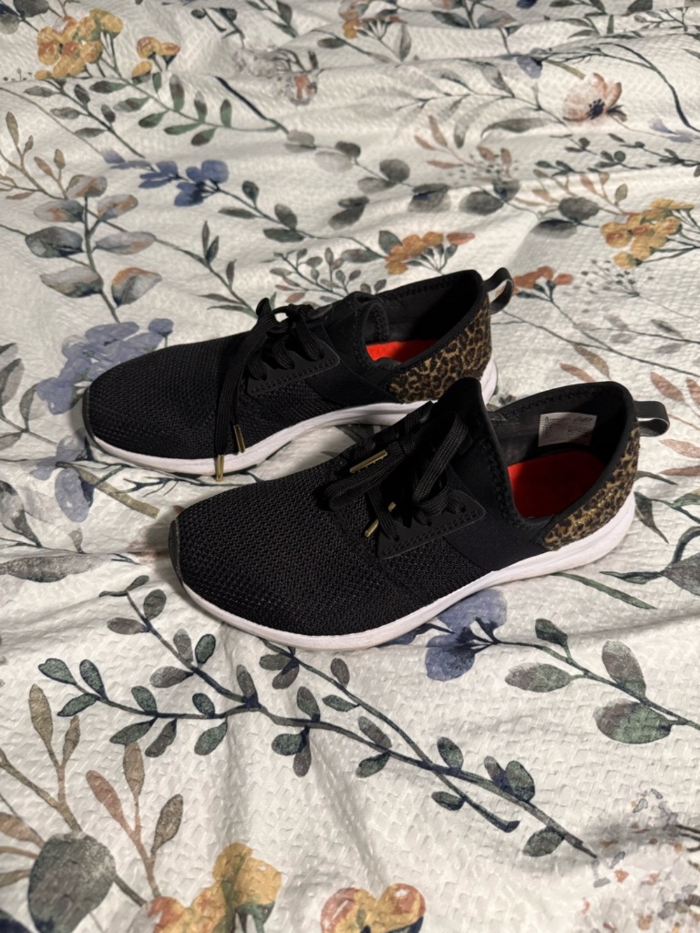 New Balance Black Athletic Sneakers with Leopard Heel Accent